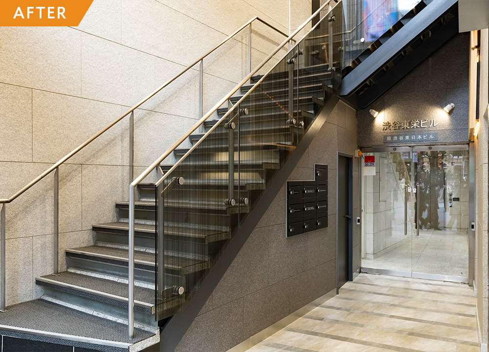 エントランス改修で印象一新、都会に映える建物へ